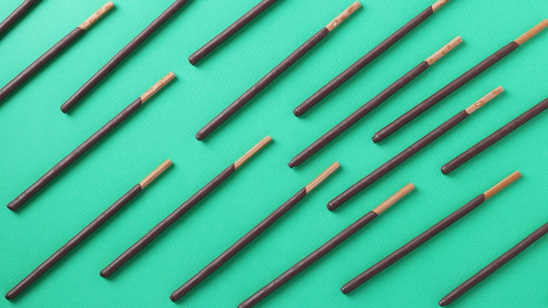 Pocky sticks on green background