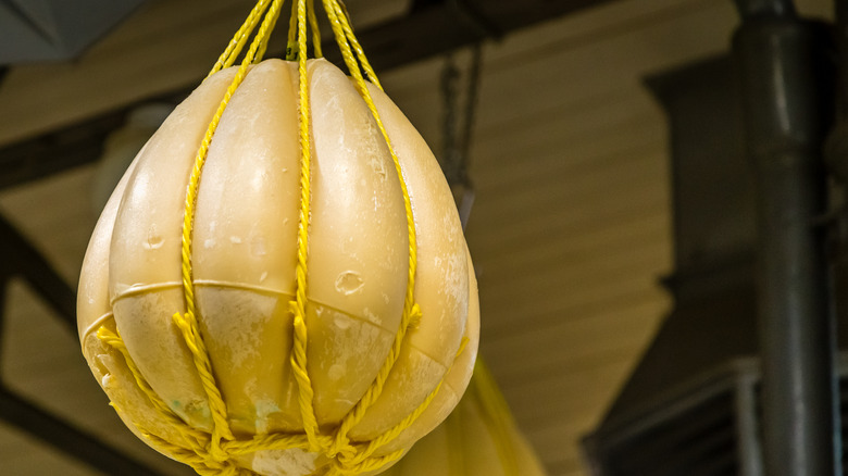 Provolone hanging from ropes