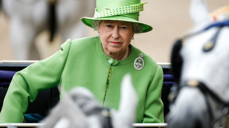 Queen Elizabeth II traveling by carriage