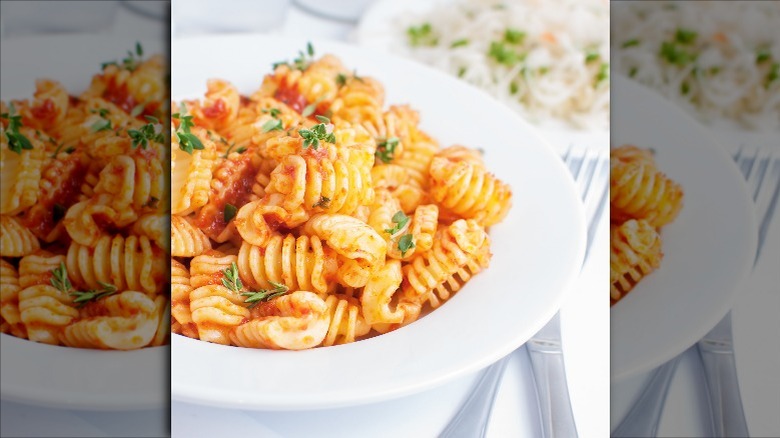 bowl of radiatori pasta with tomato sauce