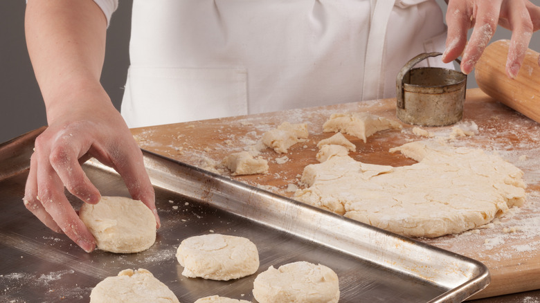 rolling out biscuits