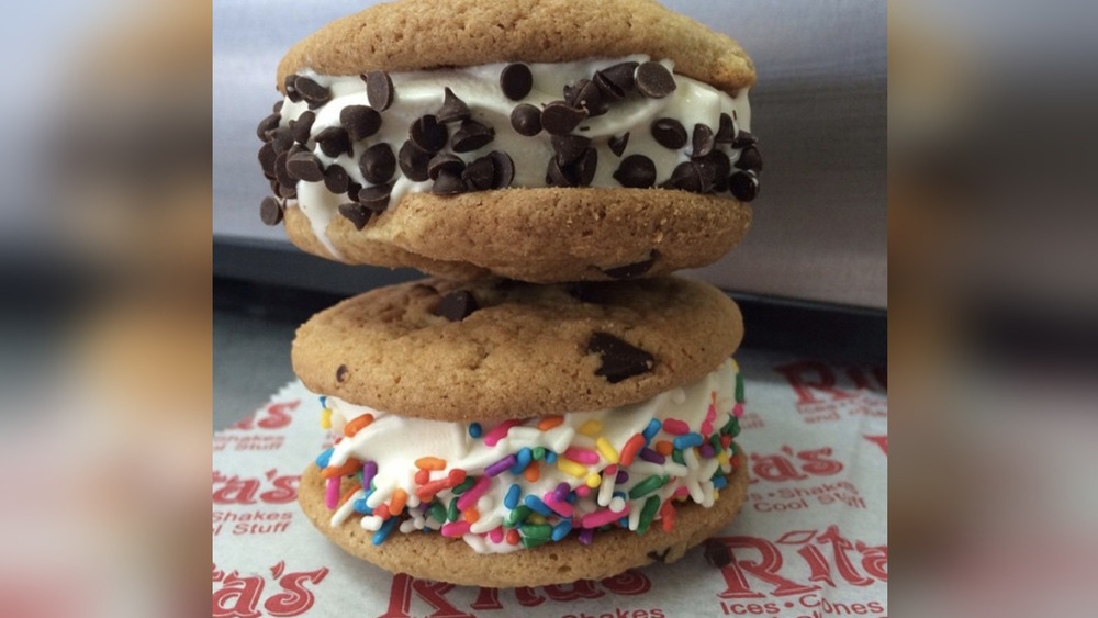 Two Rita's custard cookie sandwiches with sprinkles