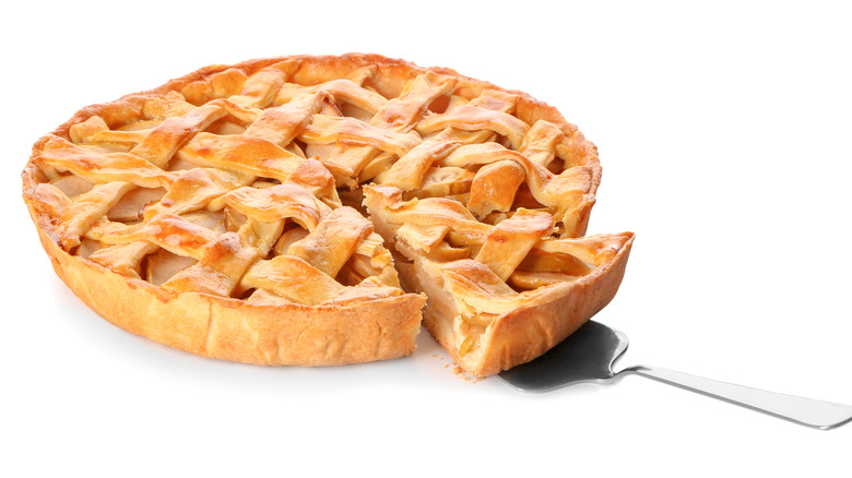 lattice top apple pie with spatula