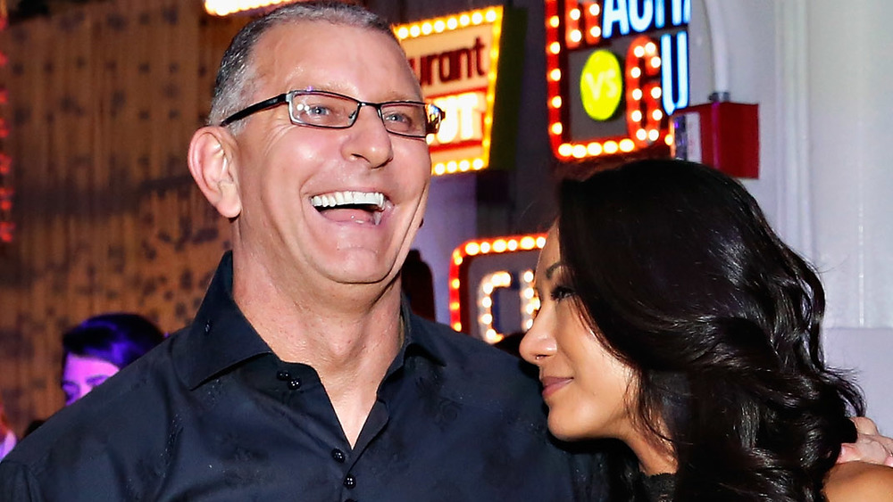 Gail and Robert laughing at an event. 