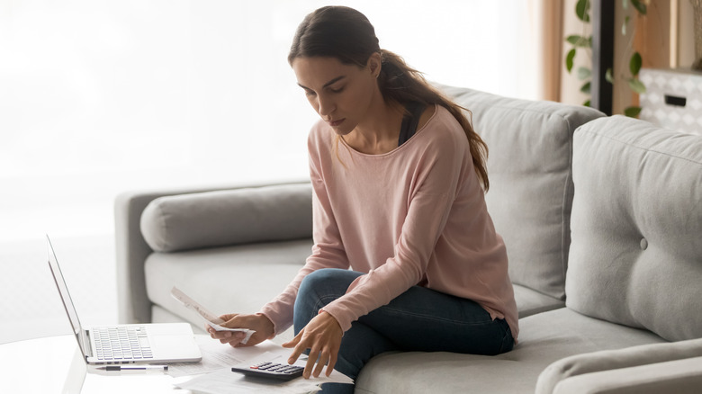 woman calculating paycheck