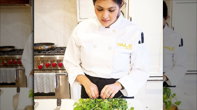 Saba Wahid working with herbs