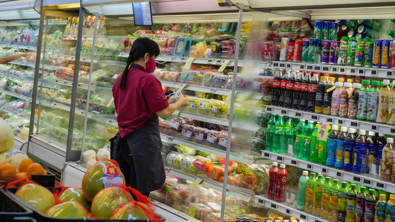 Supermarket worker wearing a face mask