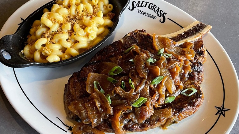 smothered steak and mac and cheese at Saltgrass Steakhouse