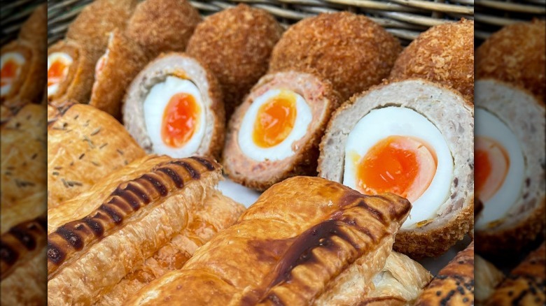 Picnic basket with Scotch eggs and pastries