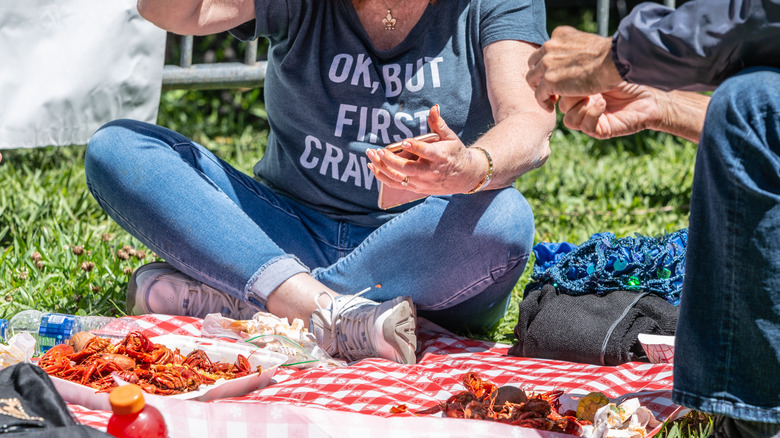 People outside eating crawfish