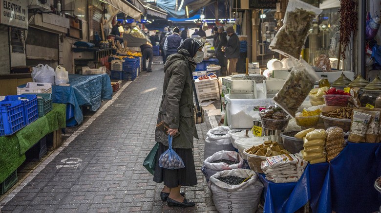 Woman buying spices at an open air market in Turkey