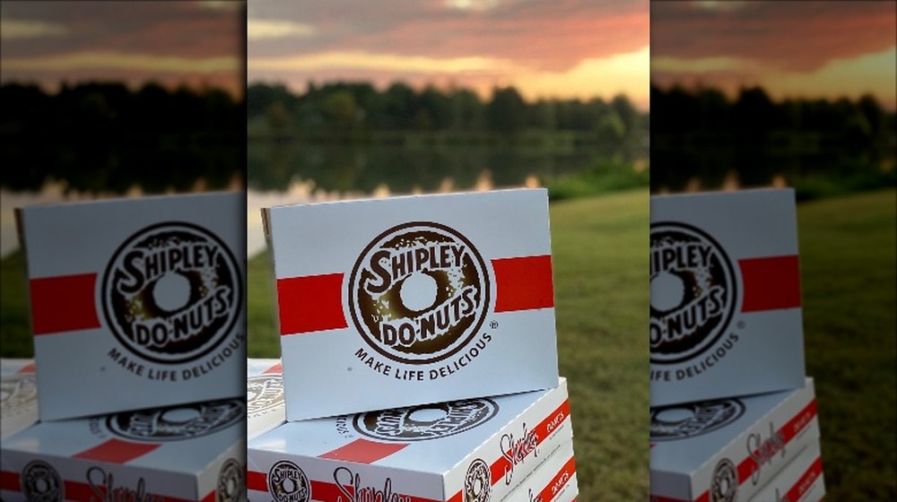 Box of Shipley doughnuts with sunset