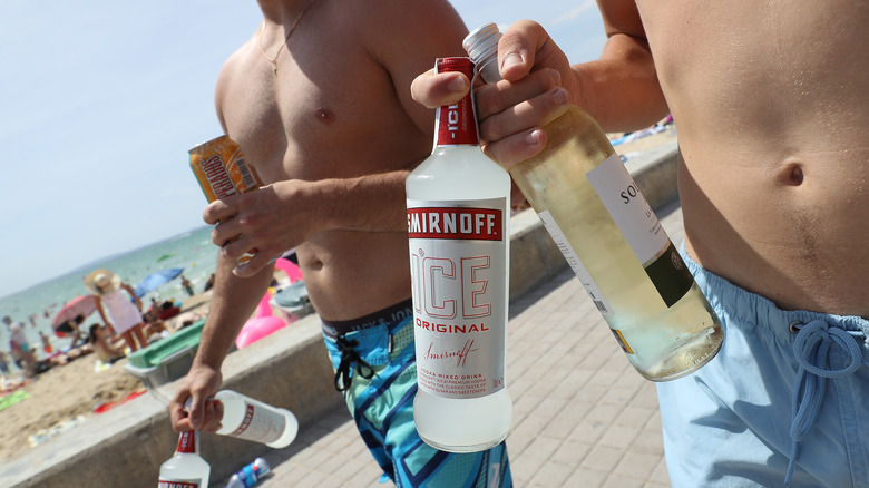 bro holding a bottle of ice