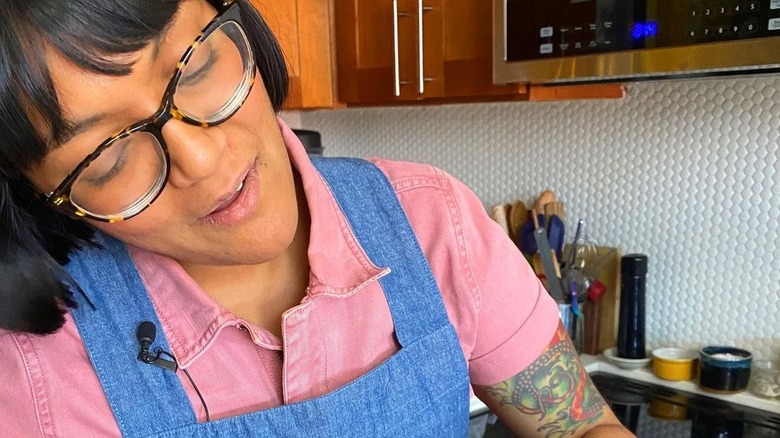 Sohla El-Waylly wearing overalls in kitchen