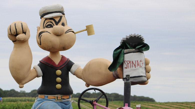 Popeye statue with spinach can 