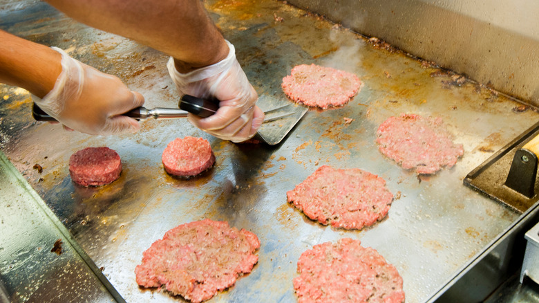 steak 'n shake steakburgers being grilled