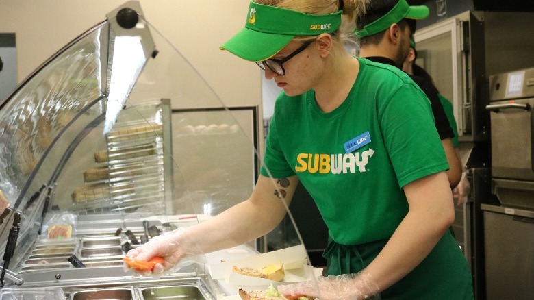 A worker at a Subway