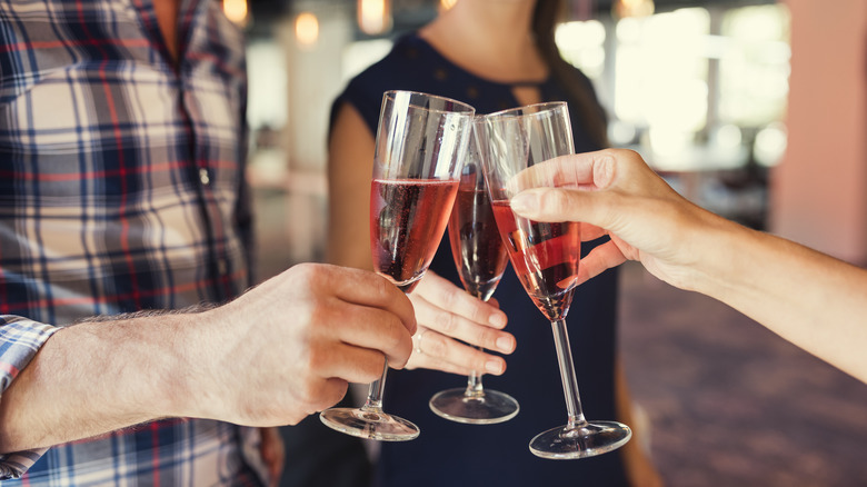 cheering champagne glasses start-up office