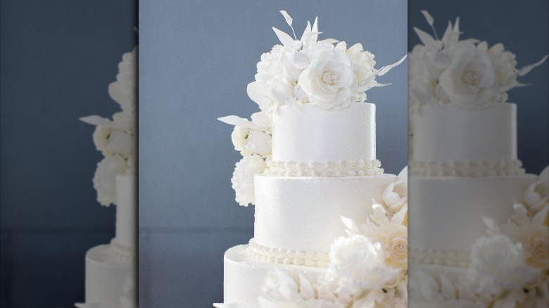 White wedding cake with sugar flowers