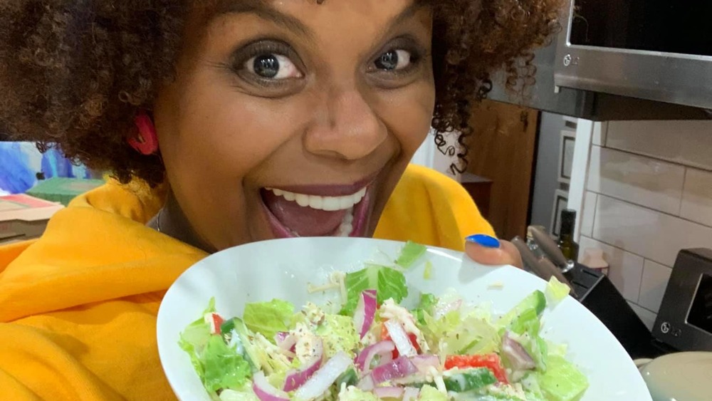 Tabitha Brown holding salad