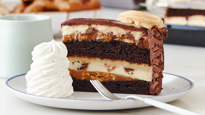 slice of reese's peanut butter chocolate cake cheesecake