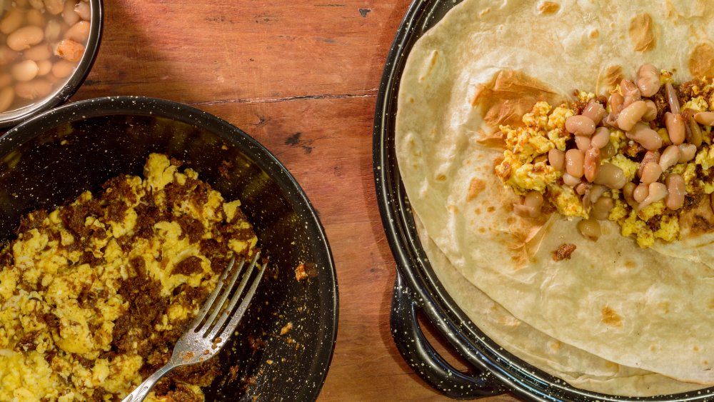 Flour Sonoran tortillas with machaca, eggs and beans/hominy