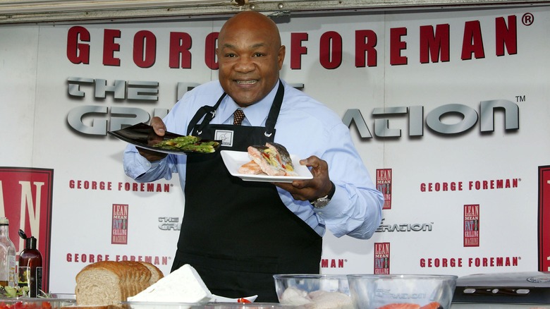 Former world heavyweight boxing champion George Foreman poses after cooking healthy food on his trademark grill on October 20, 2006 in London, England.