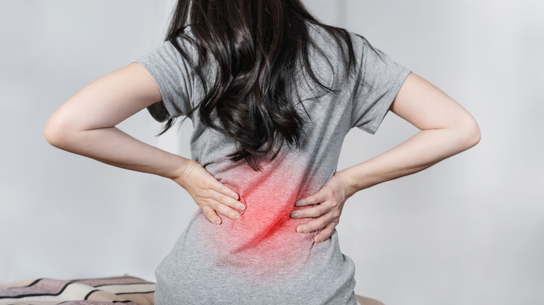 Woman suffering lower back pain