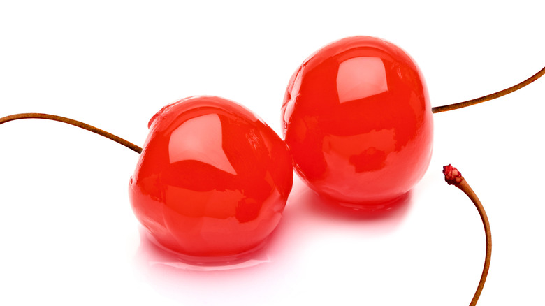 two shiny maraschino cherries 