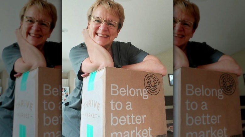 Thrive Market member with box