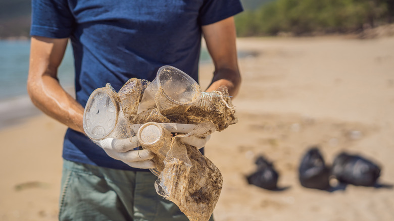 picking up trash from beach