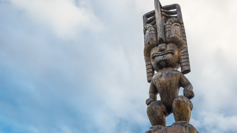 tiki statue against cloudy sky