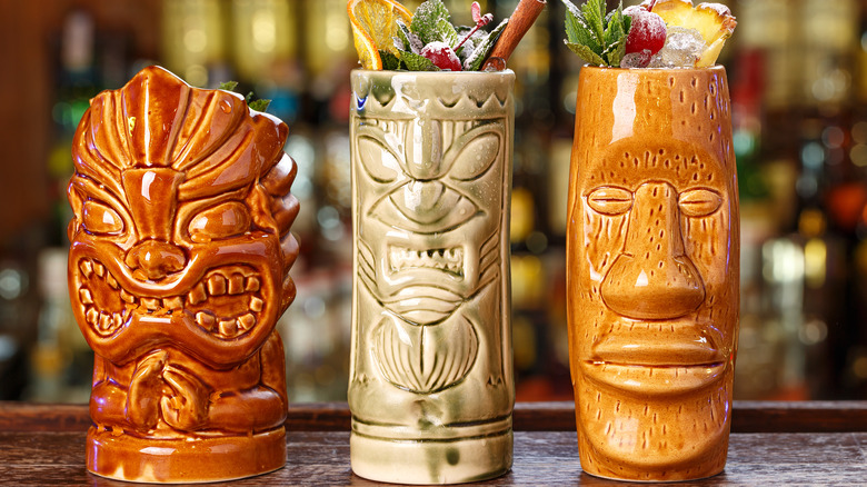 variety of tiki bar mugs