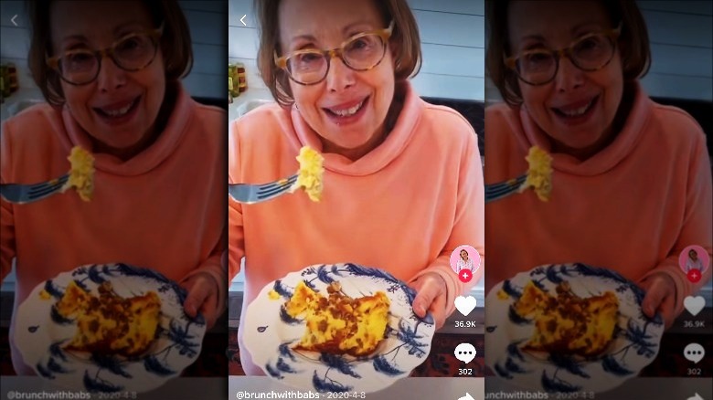 Barbara Costello holding forkful of egg casserole