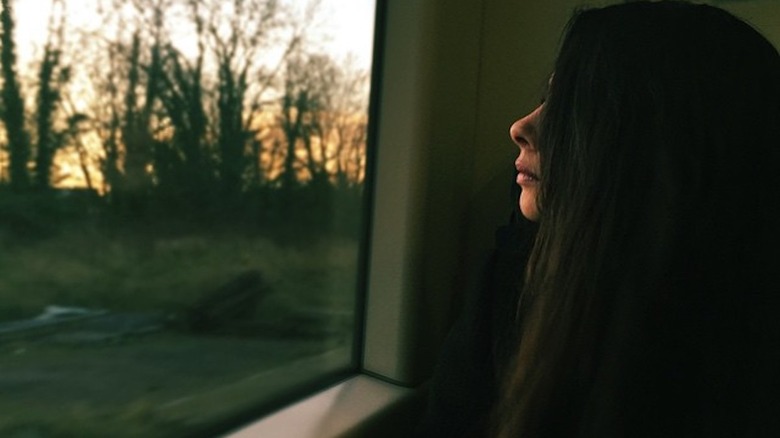 The Pasta Queen and her hair looking out a window