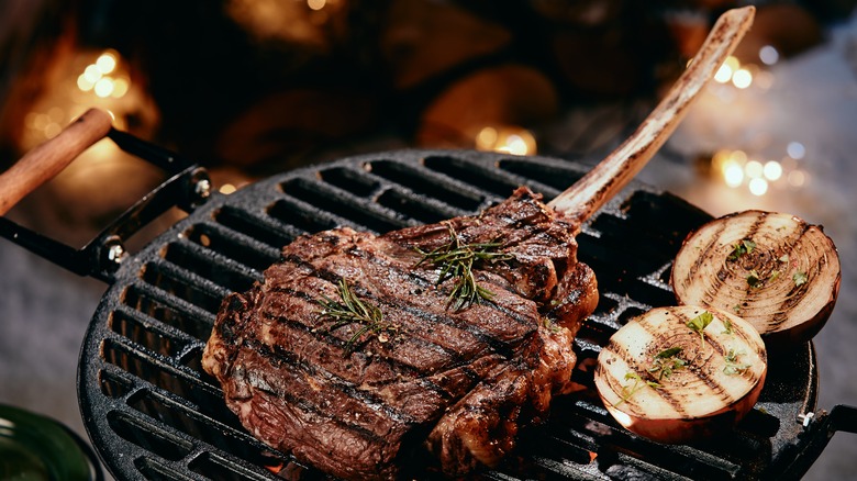 Tomahawk steak grilling