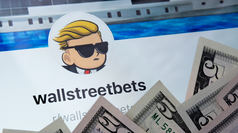 WallStreetBets Reddit board and a pile of 5 dollar bills