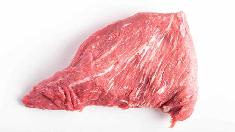 raw tri-tip steak on white background