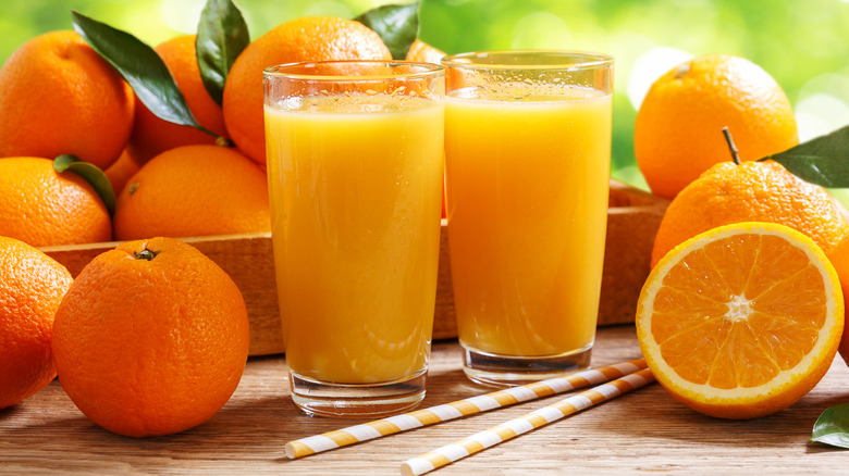 Two fresh glasses of orange juice.