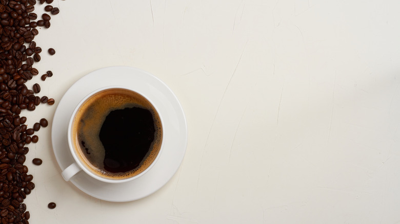 Coffee beans and coffee cup