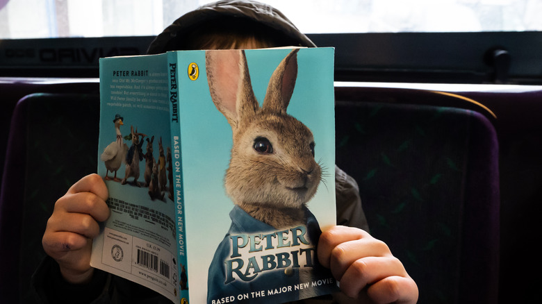 Child reading Peter Rabbit book