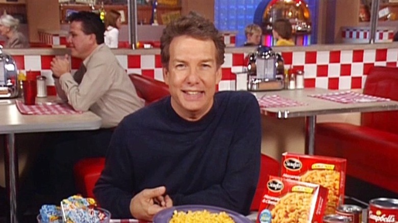 Marc Summers sitting in a diner