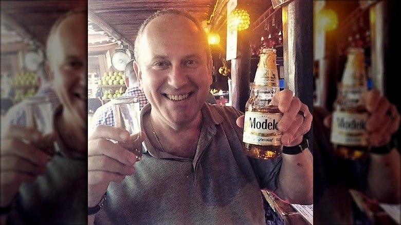 Vitaly Paley smiling with beer bottle