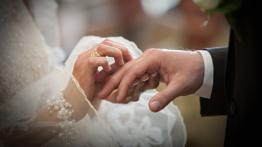 Wedding couple exchanging rings