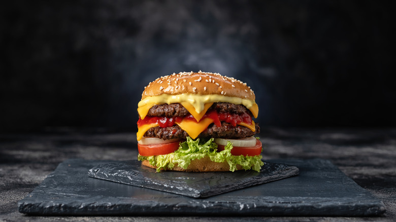 Fast food cheeseburger with steam.