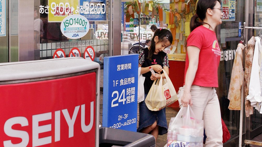 Shoppers leave a Seiyu walmart