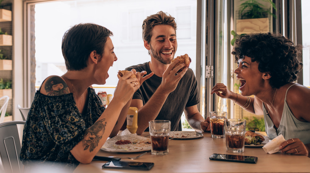 Friends eating burgers