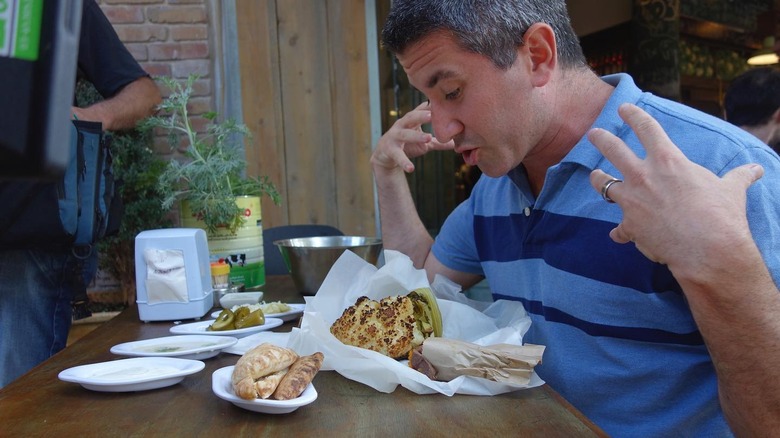 mike solomonov gesticulating at food