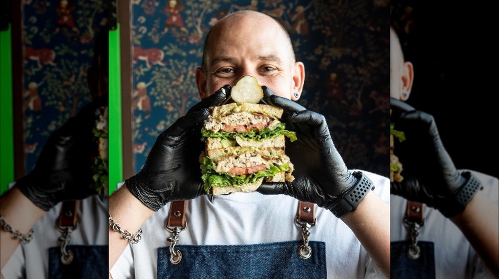 Chef Aaron Staudenmaier with a sandwich