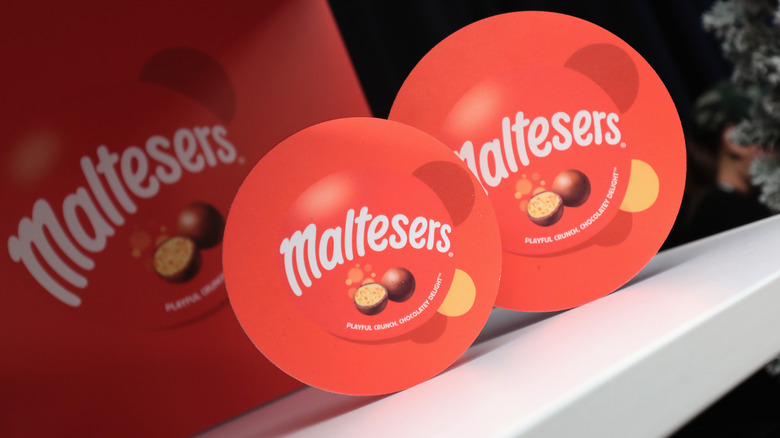 Containers of Maltesers candy